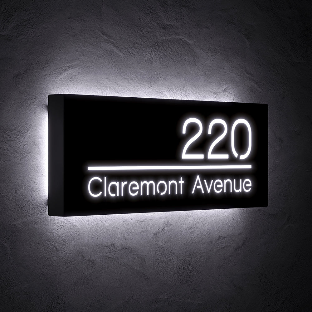 Line Design LED Address Sign with Street Name with 220 Claremont Avenue shown at an angle in white backlighting