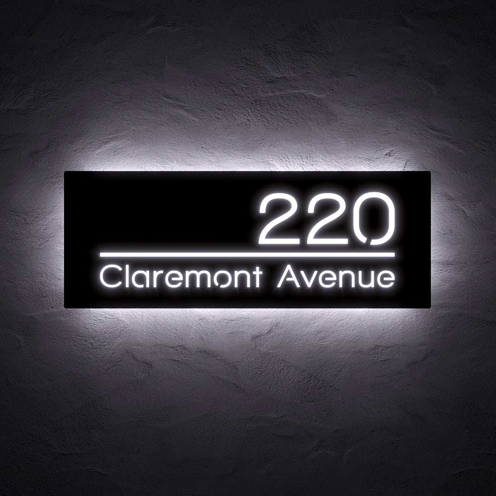 Line Design LED Address Sign with Street Name with 220 Claremont Avenue in white backlighting