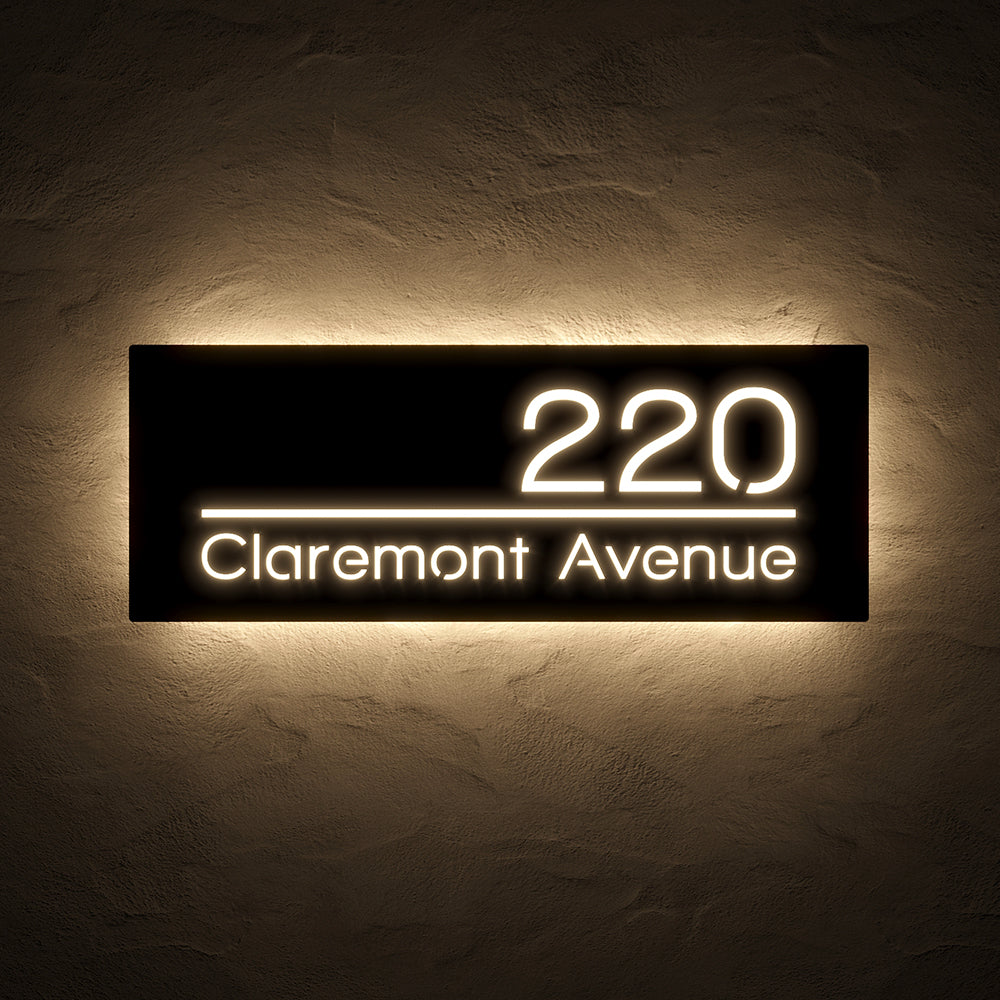 Line Design LED Address Sign with Street Name with 220 Claremont Avenue in warm white backlighting