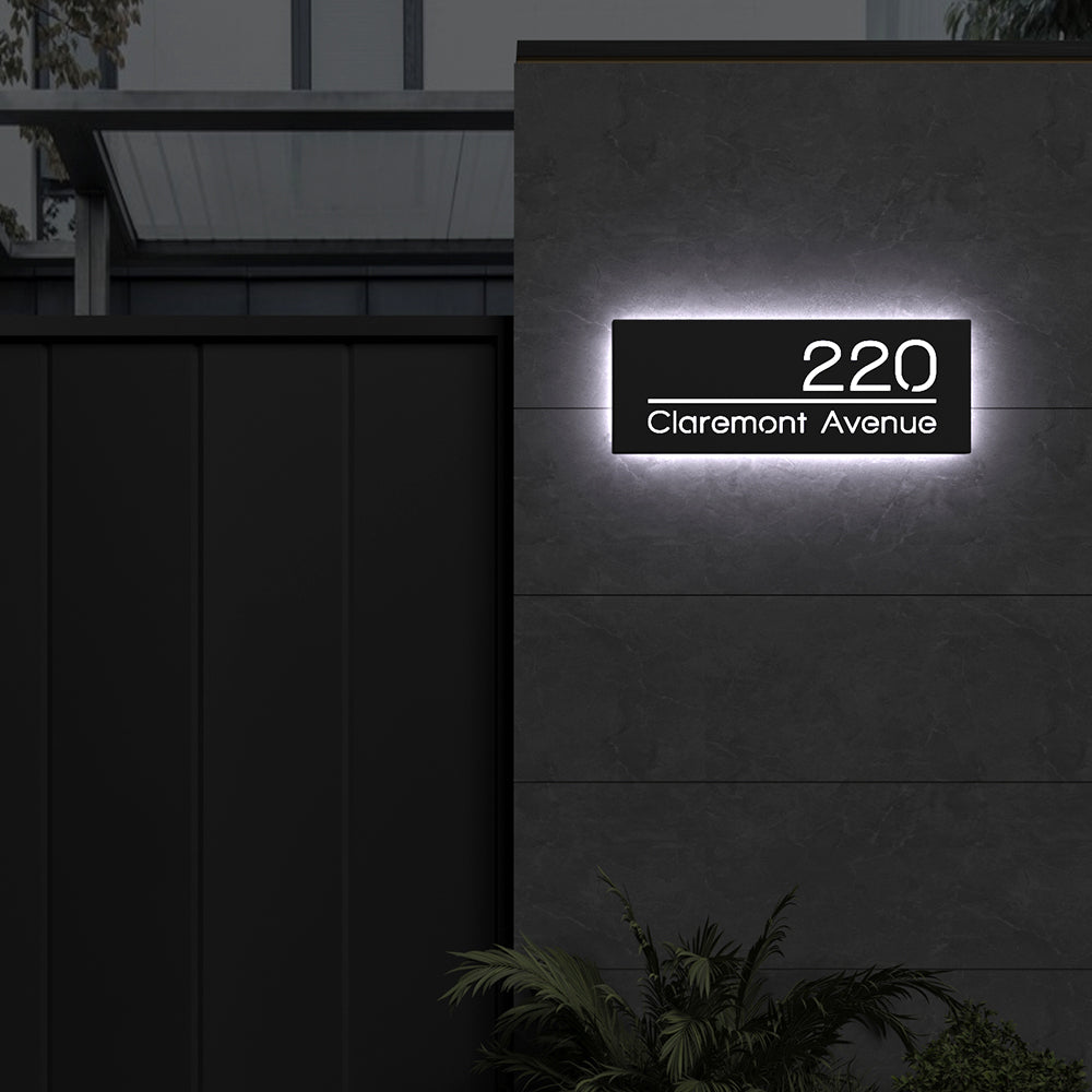 Line Design LED Address Sign with Street Name with 220 Claremont Avenue illuminated in white backlighting