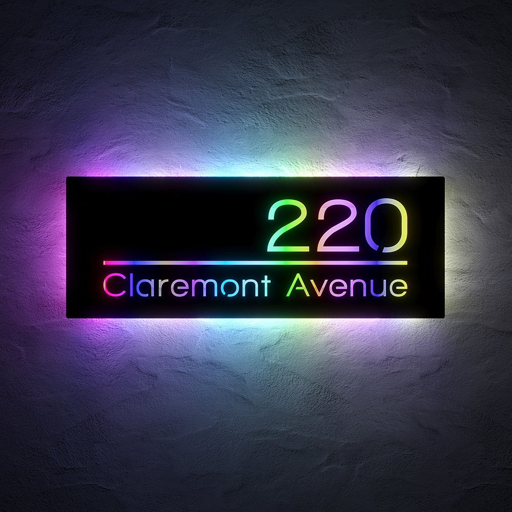 Line Design RGB LED Address Sign with Street Name with 220 Claremont Avenue illuminated in multicolor RGB light