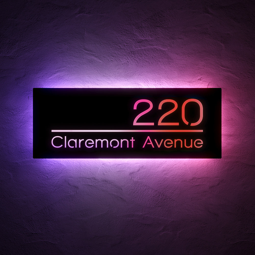 Line Design RGB LED Address Sign with Street Name with 220 Claremont Avenue illuminated in red and purple RGB light