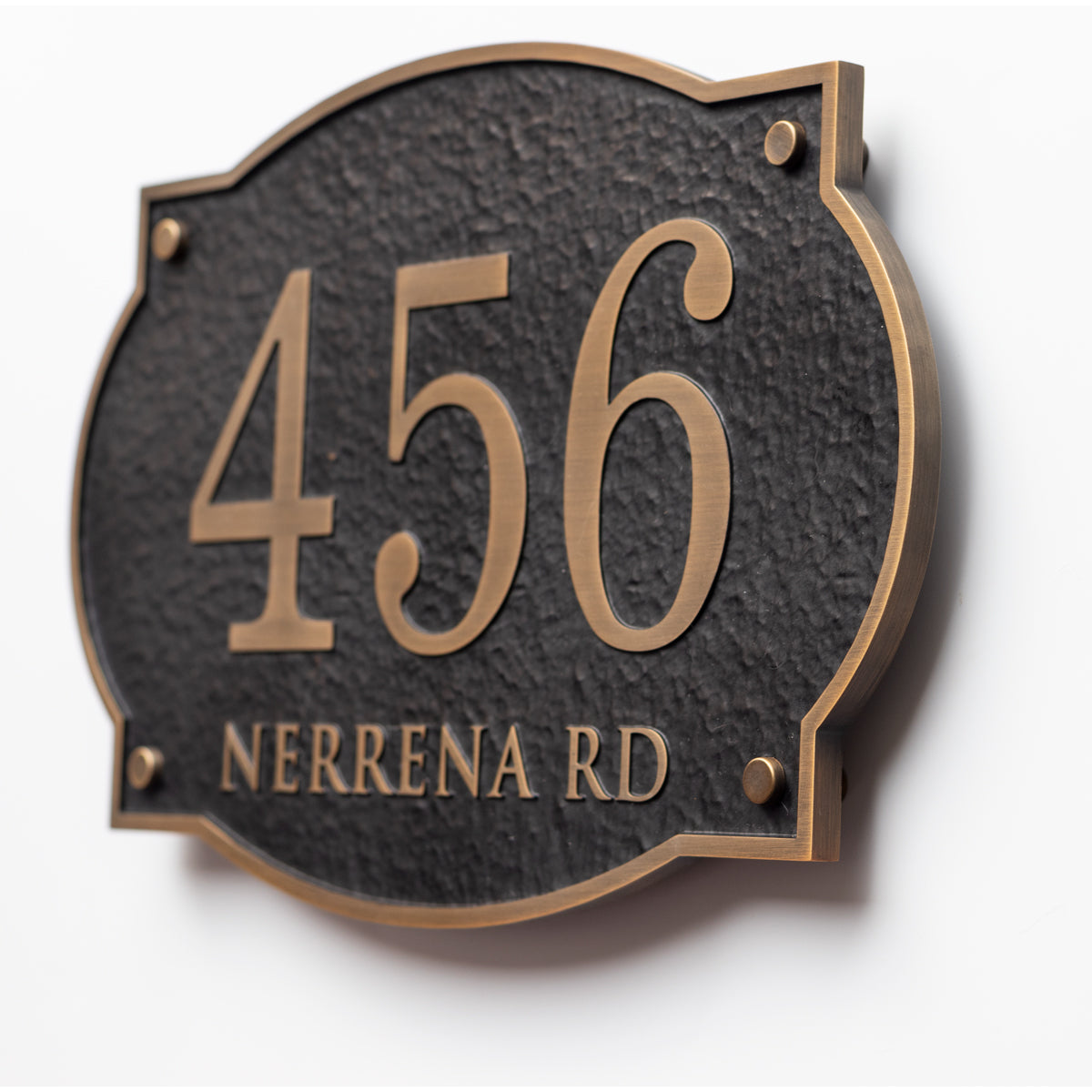 Custom solid aluminum address plaque with house number and street name on white background